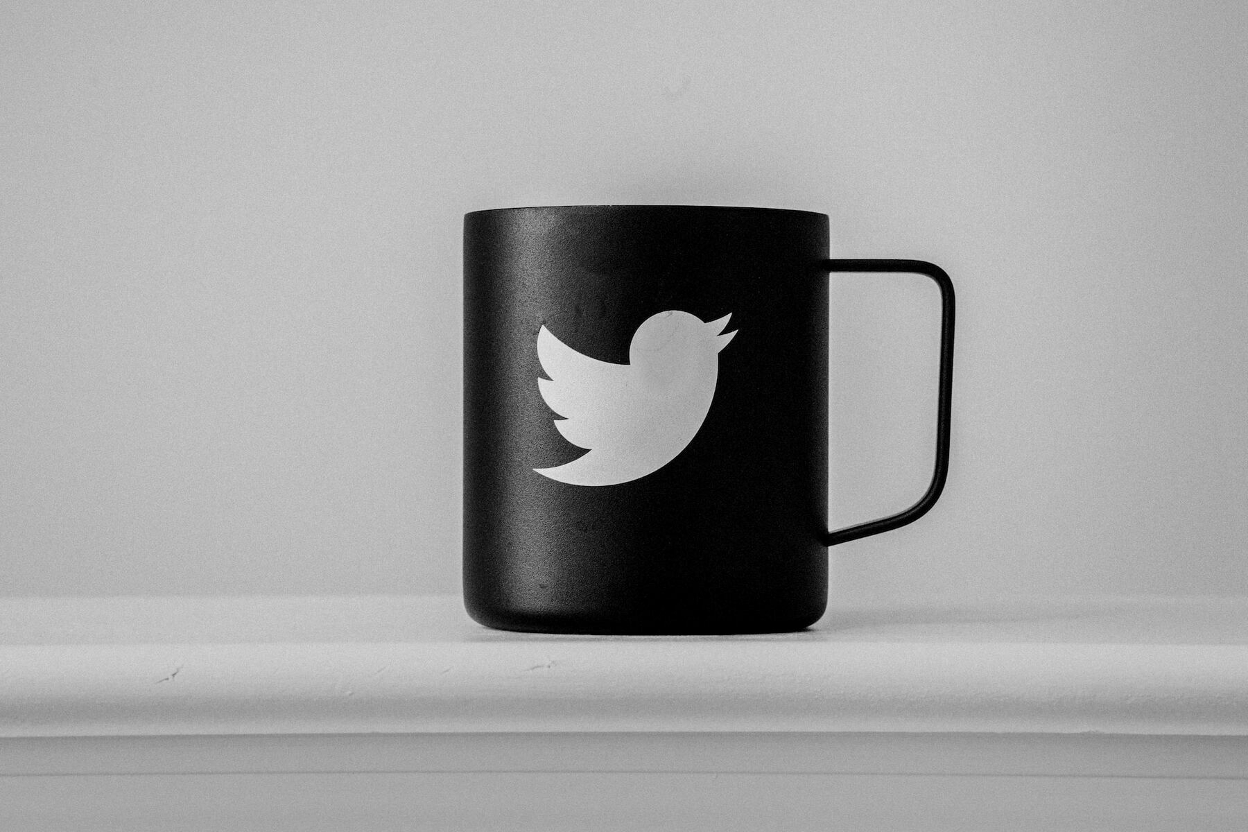 Black mug featuring white Twitter logo